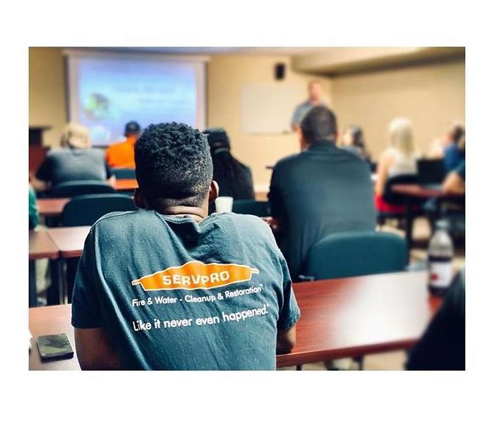 servpro logo on the back of a tshirt during a wips meeting 